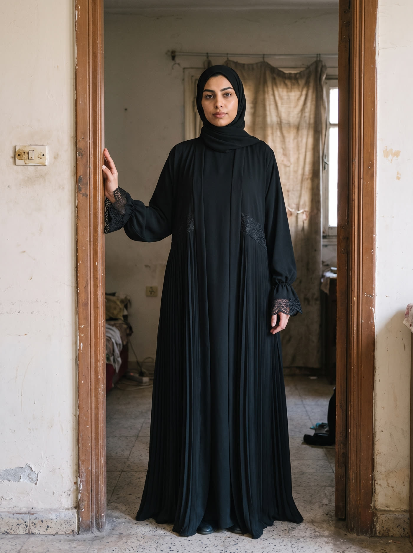 Black Robe abaya photographed in a Cairo apartment doorway